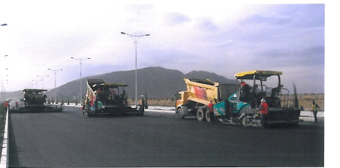Heavy Construction Dump Trucks & Asphalt Pavers